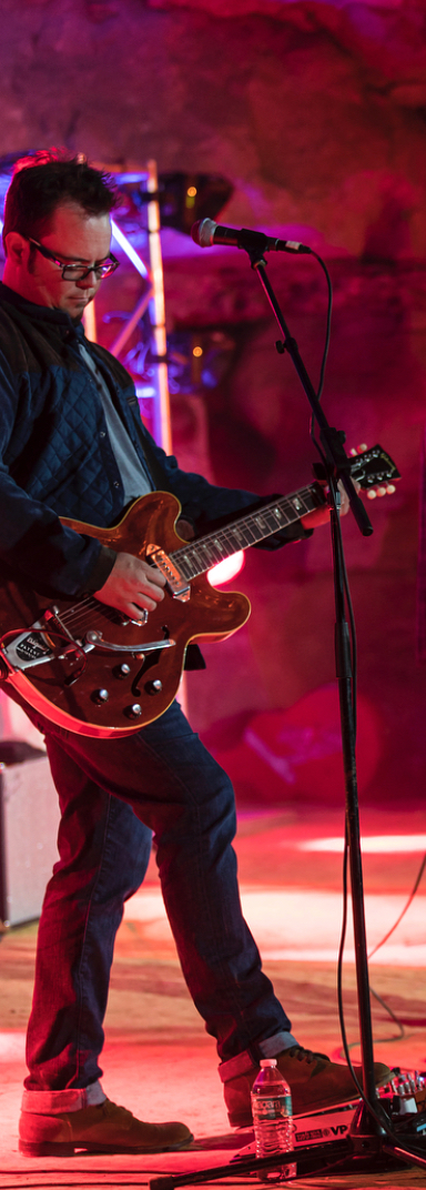 Red stage light semi-hollow guitar